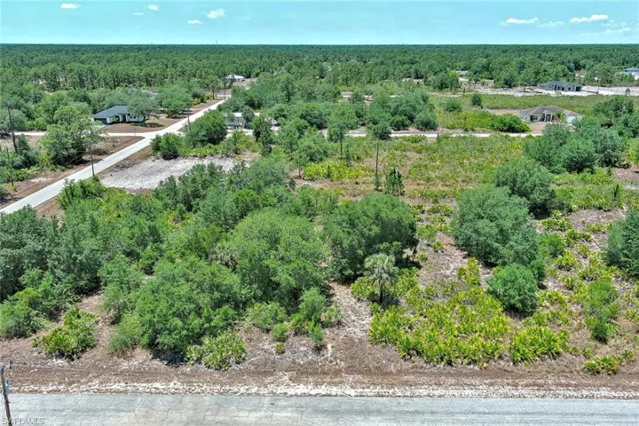 Aerial overview of property's location with a forest