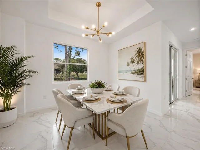 Dining area with polished marble-look tile flooring