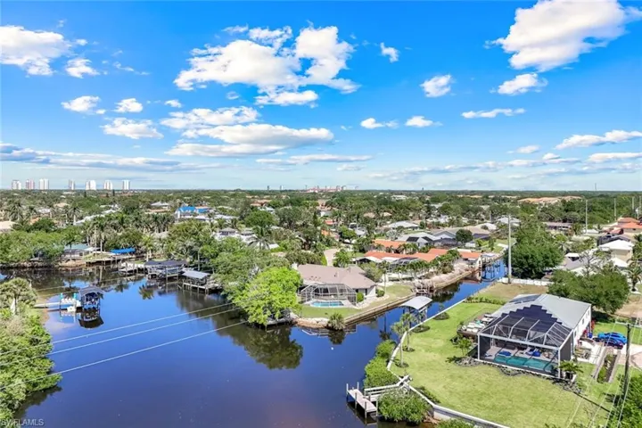 Birds eye view of property featuring a residential view and a water view
