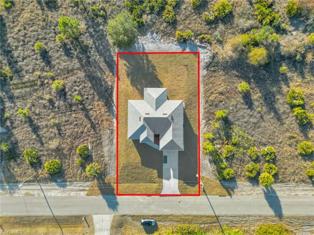 Aerial overview of property's location featuring property parcel outlined