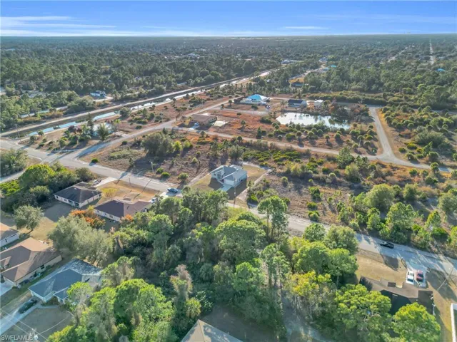 Aerial overview of property's location with nearby suburban area