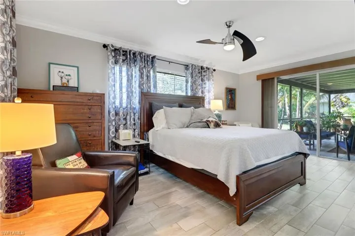 Bedroom with access to exterior, multiple windows, crown molding, ceiling fan, and recessed lighting