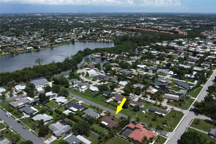 Aerial overview of property's location featuring nearby suburban area