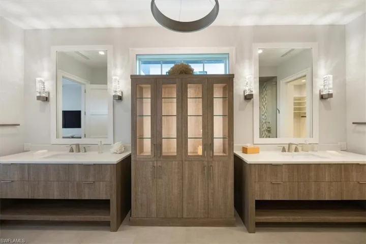 Bathroom featuring tile patterned floors and vanity