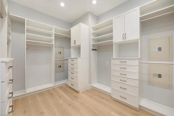 Spacious closet featuring light wood-type flooring