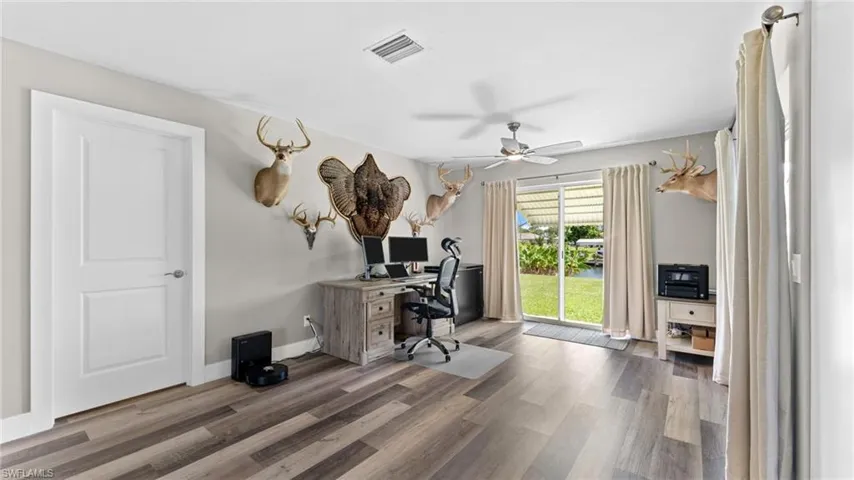 Office area featuring ceiling fan and wood-type flooring