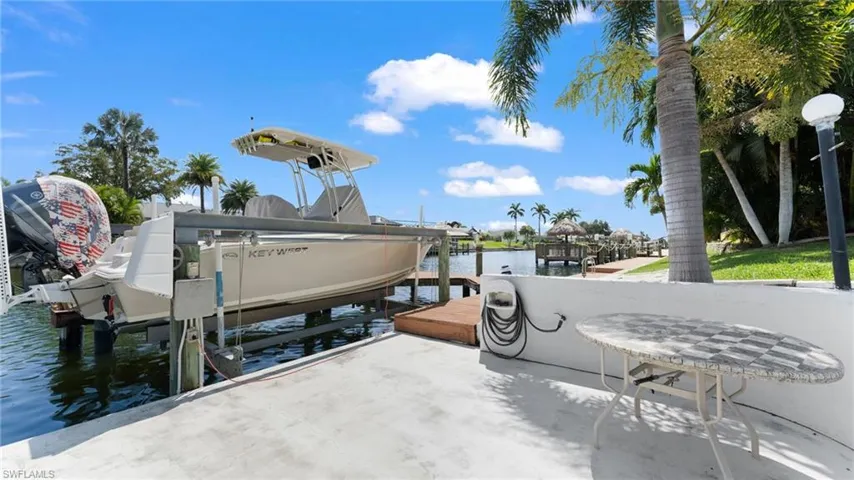 Dock area featuring a water view