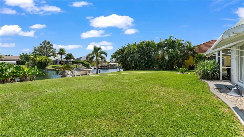 View of yard with a water view