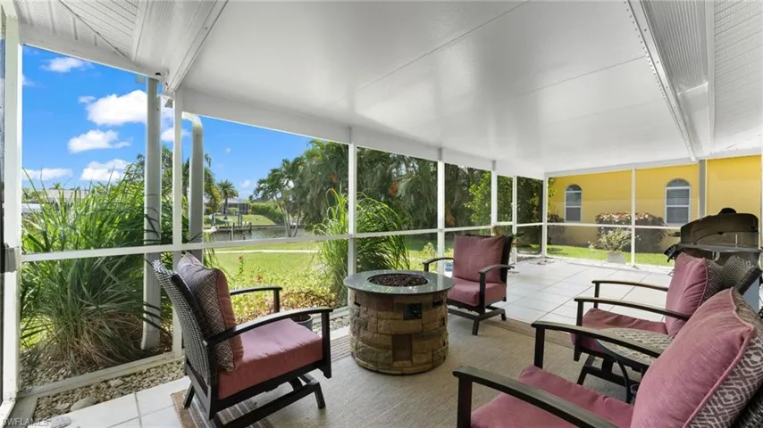 Sunroom / solarium with a water view