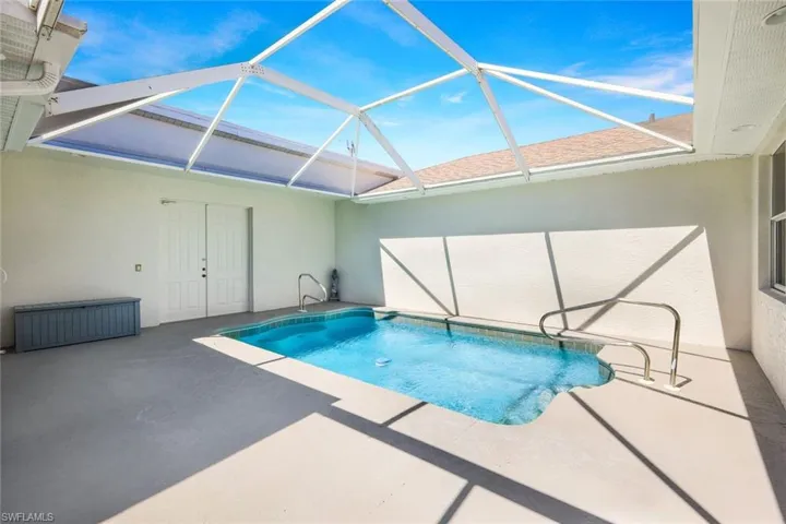 Spacious decking area surrounding pool.