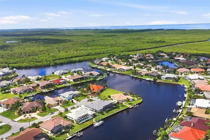 Waterfront community with canal access, surrounded by extensive natural preserves and distant ocean views