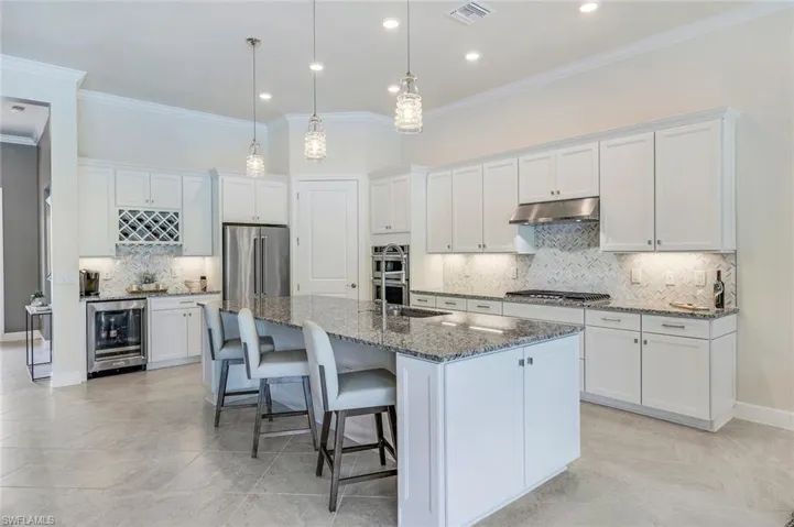 Kitchens coffee nook has wine cooler, built in wine rack, everything drawer, walk in pantry
