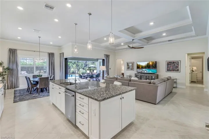 Kitchen with white cabinets, entire home bathed in natural light