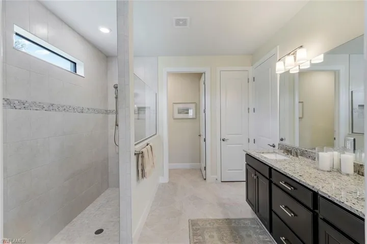 Bathroom features zero entry tiled shower