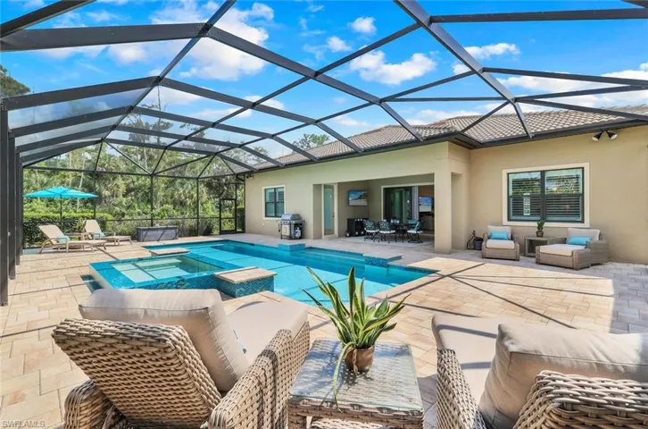 View of large patio pool deck to house