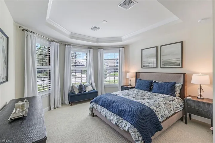3rd bedroom, ensuite a recessed ceiling, crown molding, its own bath and closet