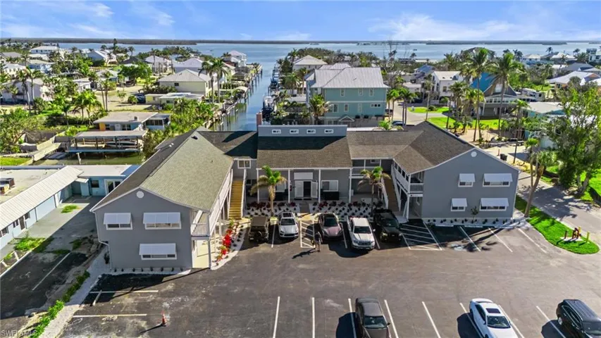 Aerial view of residential area featuring a large body of water