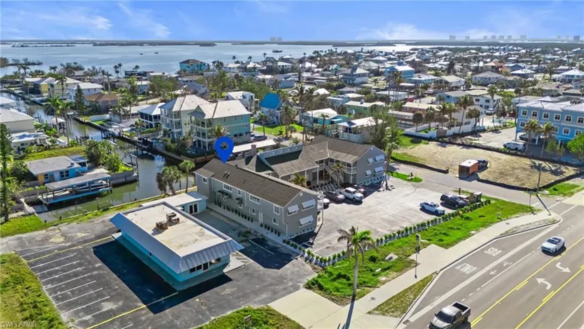 Aerial view of residential area with a nearby body of water