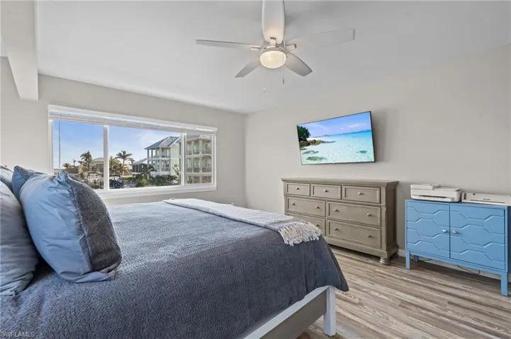 Bedroom featuring light wood finished floors and ceiling fan