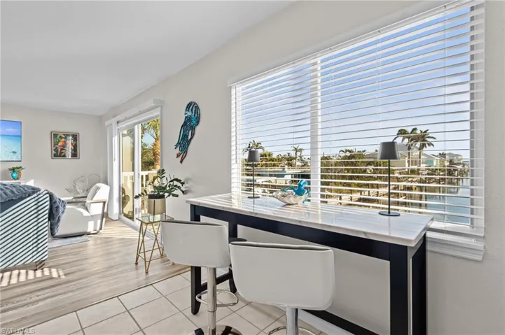 Dining space featuring light tile patterned floors
