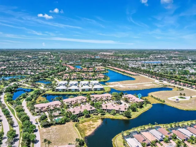 Drone / aerial view featuring a residential view and a water view
