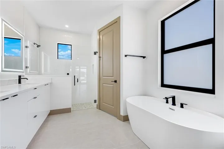 Main bathroom offer separate shower, and freestanding bathtub, and double vanity