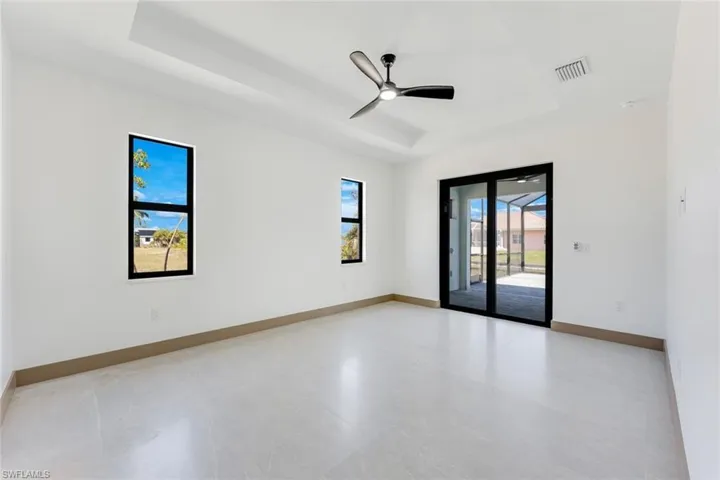 Main Bedroom with sliding doors to the lanai