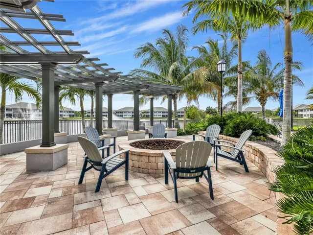View of patio / terrace with a pergola, a residential view, and a fire pit