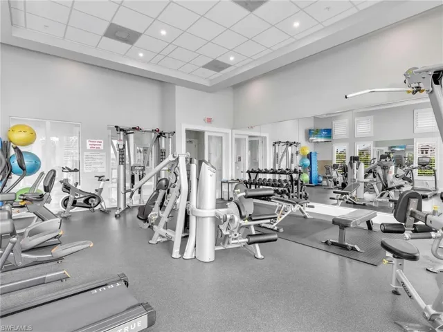 Gym featuring a high drop ceiling