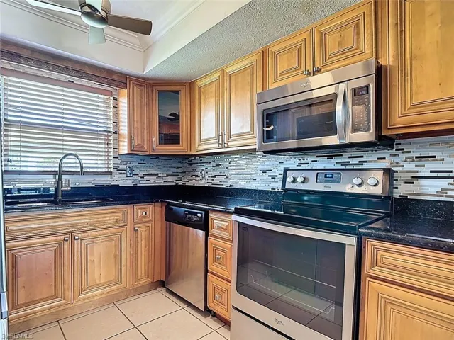 The Kitchen Fearturs Stainless Steel Appliances and Granite Tops