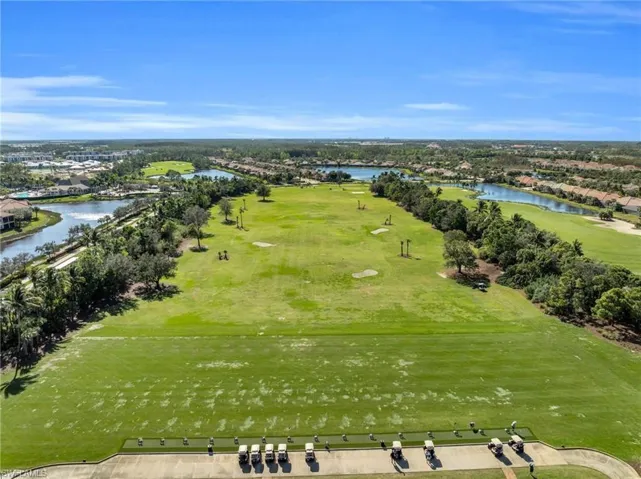Aerial view of a local golf course and a nearby body of water
