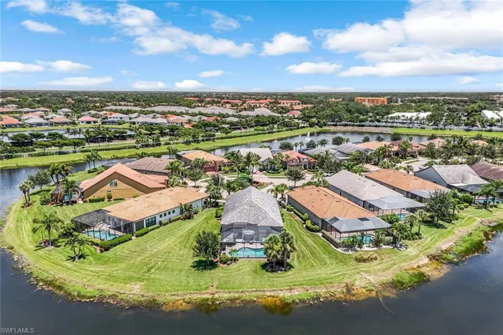 Aerial perspective of suburban area with a large body of water