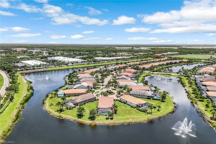 Aerial perspective of suburban area with a nearby body of water