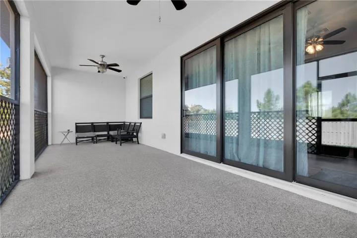 Sunroom / solarium with a ceiling fan and an outdoor hangout area