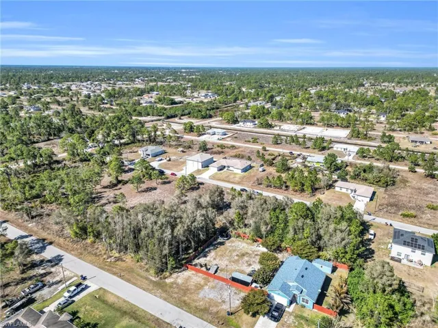 Aerial overview of property's location featuring nearby suburban area