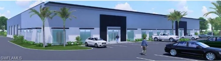 View of property featuring uncovered parking