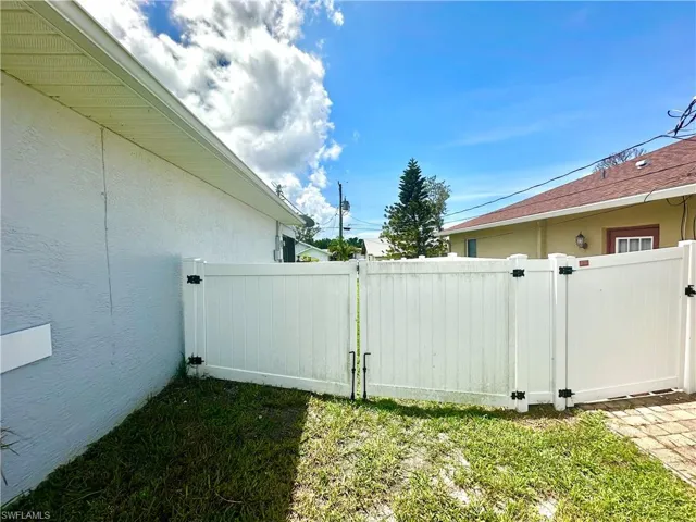 View of yard with a gate