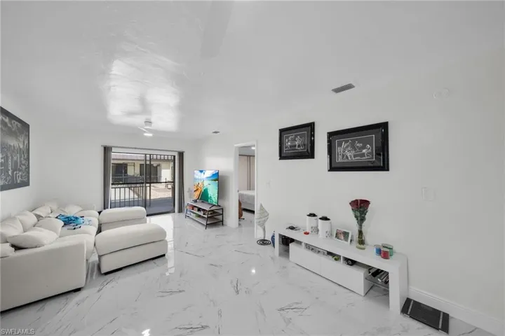 Living room with light marble finish flooring