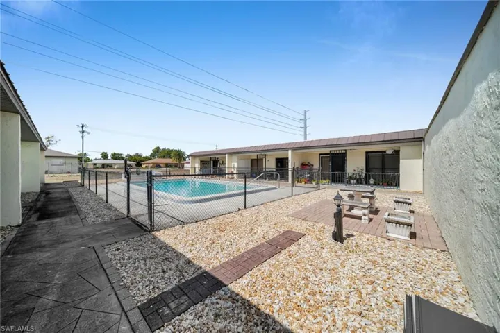 Community pool featuring a patio