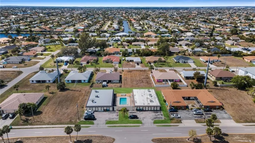 Aerial overview of property's location with nearby suburban area