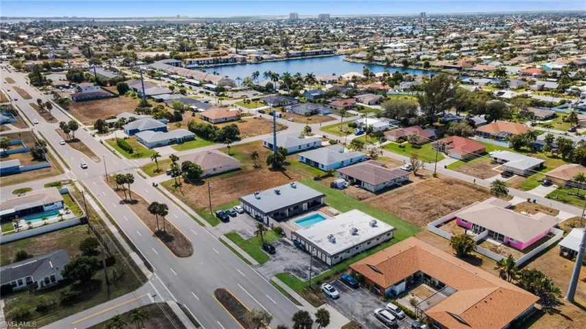 View of property location featuring nearby suburban area and a nearby body of water