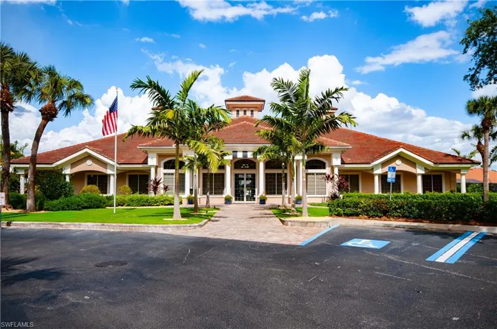 View of property with uncovered parking