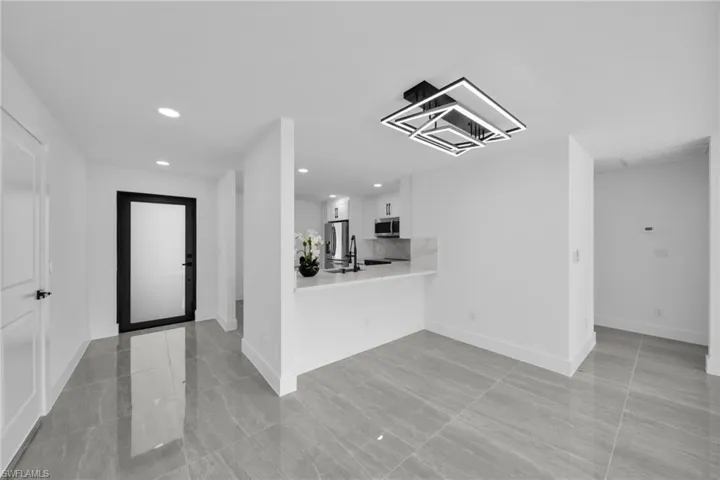 Entryway featuring recessed lighting and baseboards