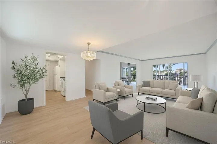 Virtually Staged with new flooring and spatial reference to furniture.  There is room for a dining room too!