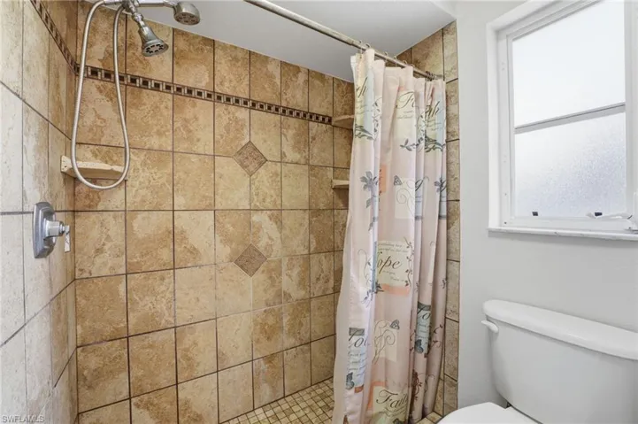 Full bathroom with a stall shower