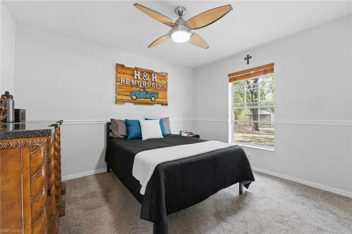 Bedroom with carpet and ceiling fan