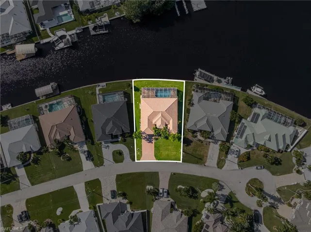 View of property location featuring nearby suburban area and a nearby body of water