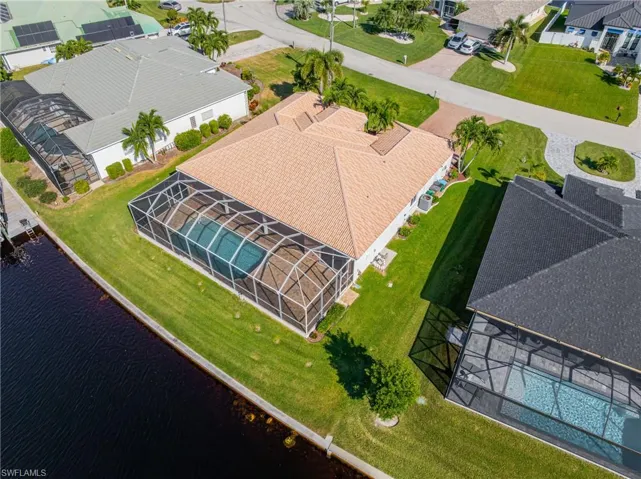 Aerial perspective of suburban area with a pool area