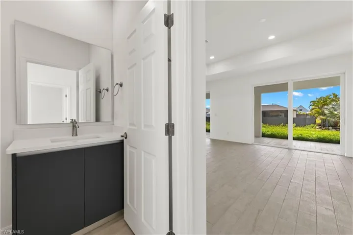 Bathroom featuring hardwood / wood-style flooring and vanity
