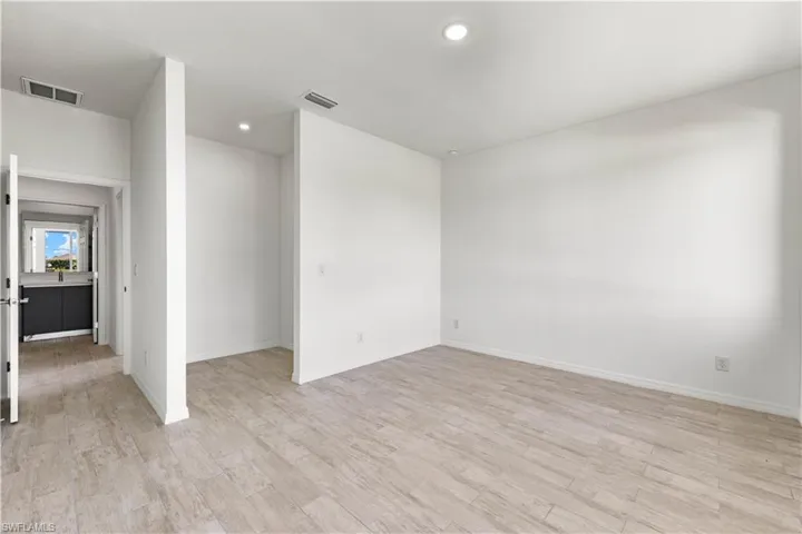 Spare room featuring light hardwood / wood-style flooring